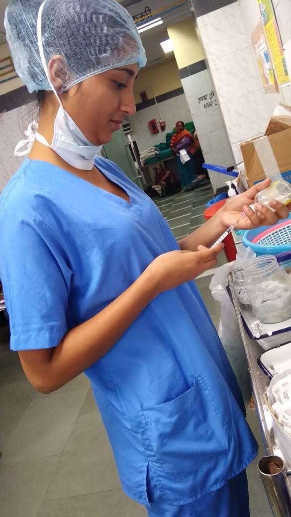 MedicoAtHome nurse preparing medication for a patient